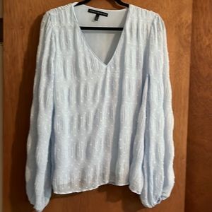 Never worn, light blue blouse